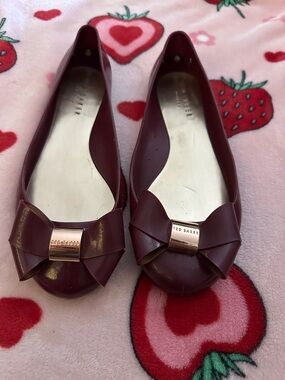 Ted Baker  Burgundy Jelly Bow Ballet Flats with Rose Gold Accent